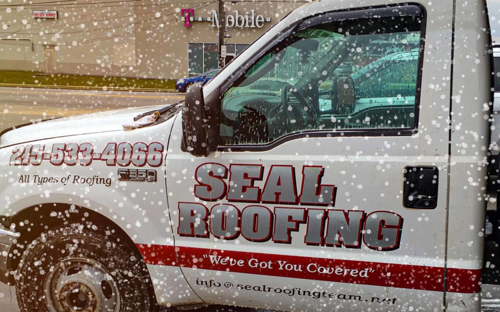 Seal Roofing Snow Plow truck in front of t mobile store