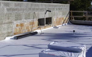 Commercial rooftop with various white TPO materials
