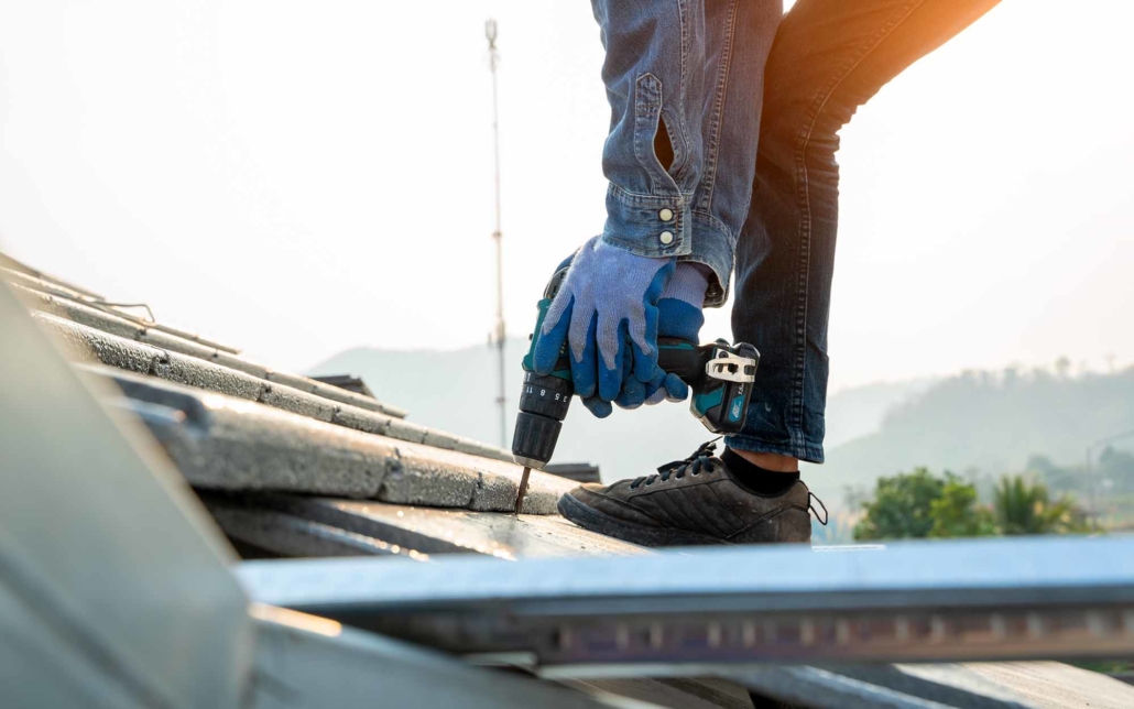 Roofing worker doing repairs on a commercial rooftop