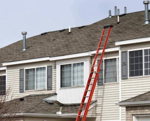 Ladder leaning against a residential home