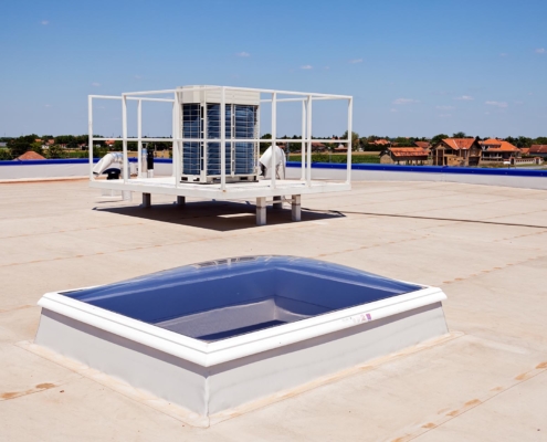 Skylight and HVAC system features on a commercial roof