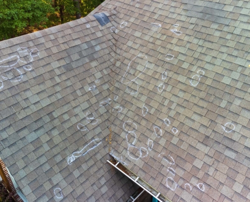 inspection marks on residential roof from hail damage
