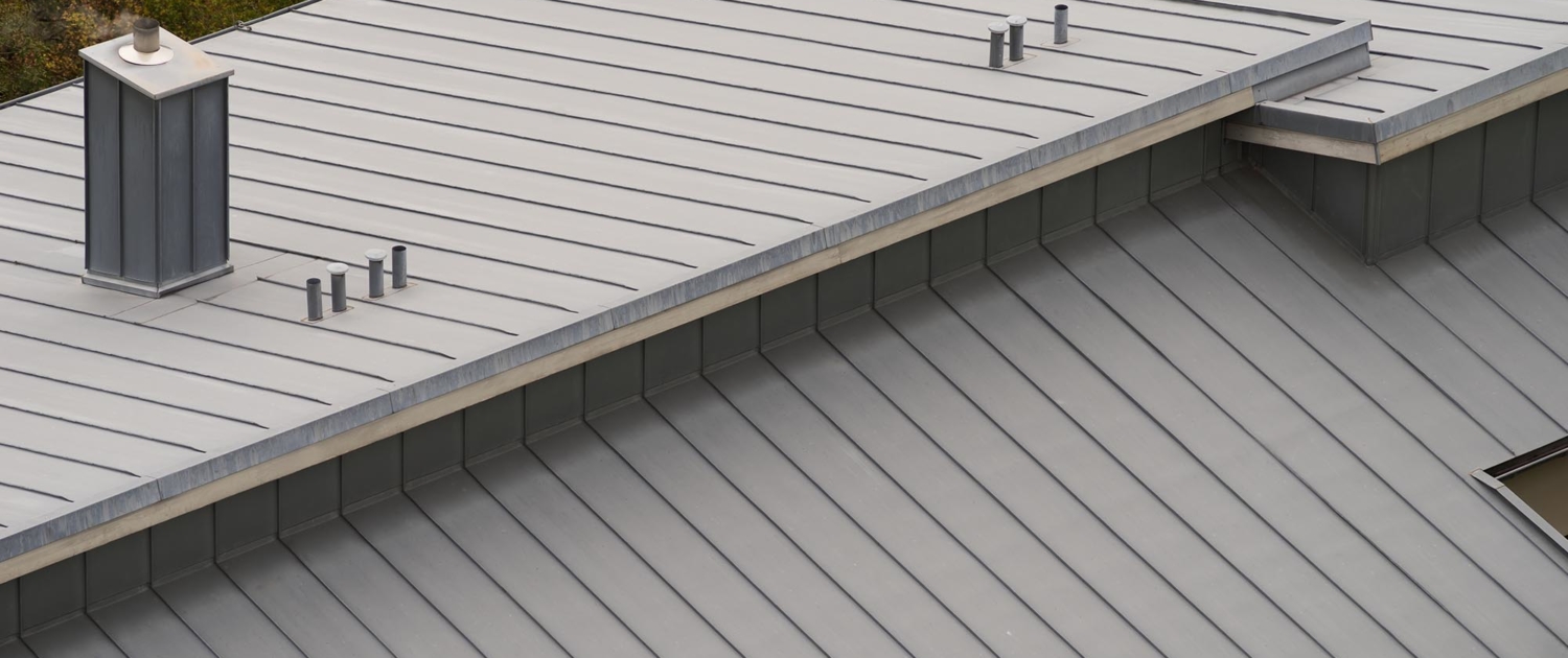 Overhead view of a grey commercial metal roof
