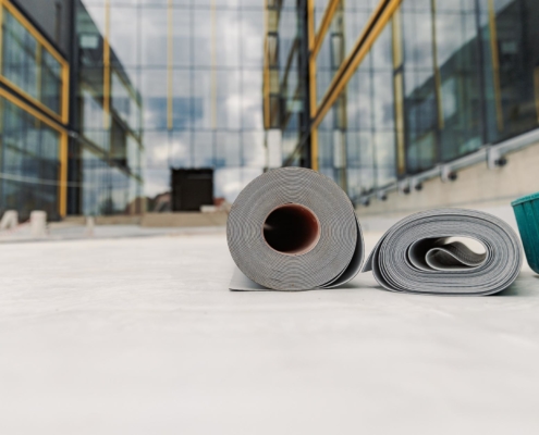 Rolls of TPO Roofing material on rooftop